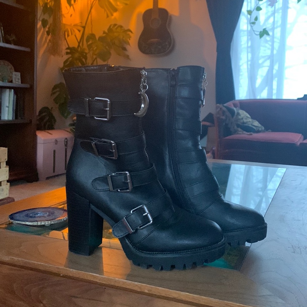 Witchy black heeled buckle boots with moon zipper